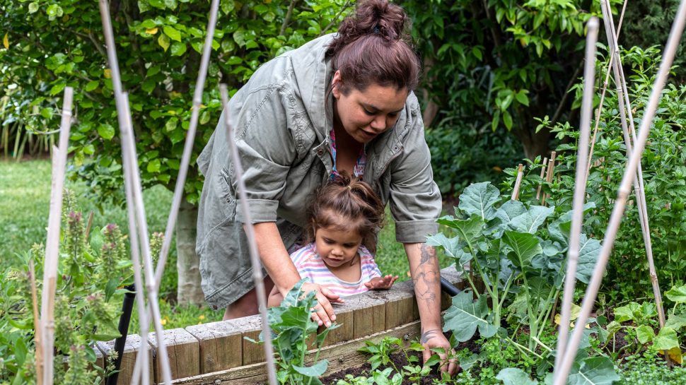 Mother and child planting vegetables